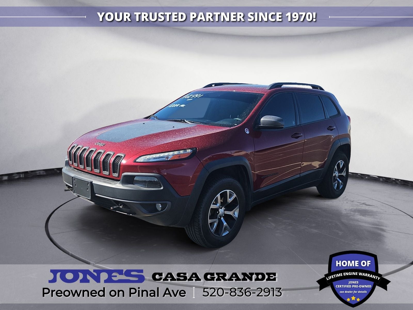2017 Jeep Cherokee Trailhawk in Deep Cherry Red Crystal Pearlcoat — front three-quarter view