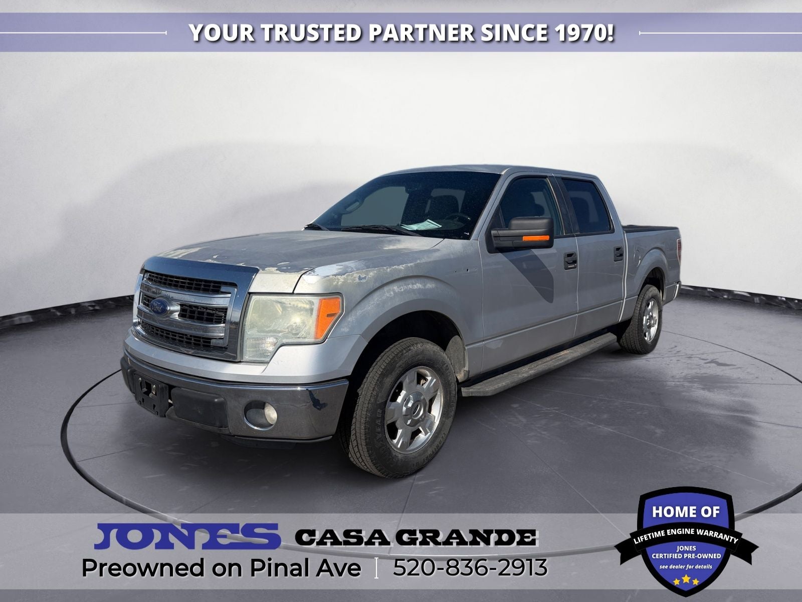 2014 Ford F-150 XLT in Ingot Silver Metallic — front three-quarter view