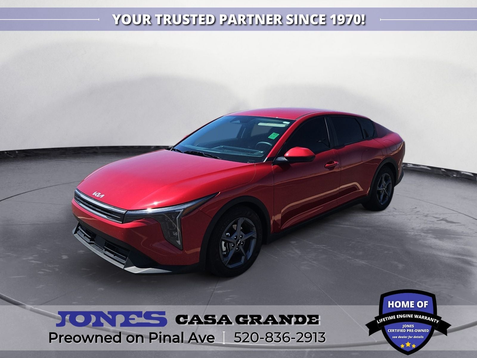 2025 Kia K4 LXS in Currant Red — front three-quarter view