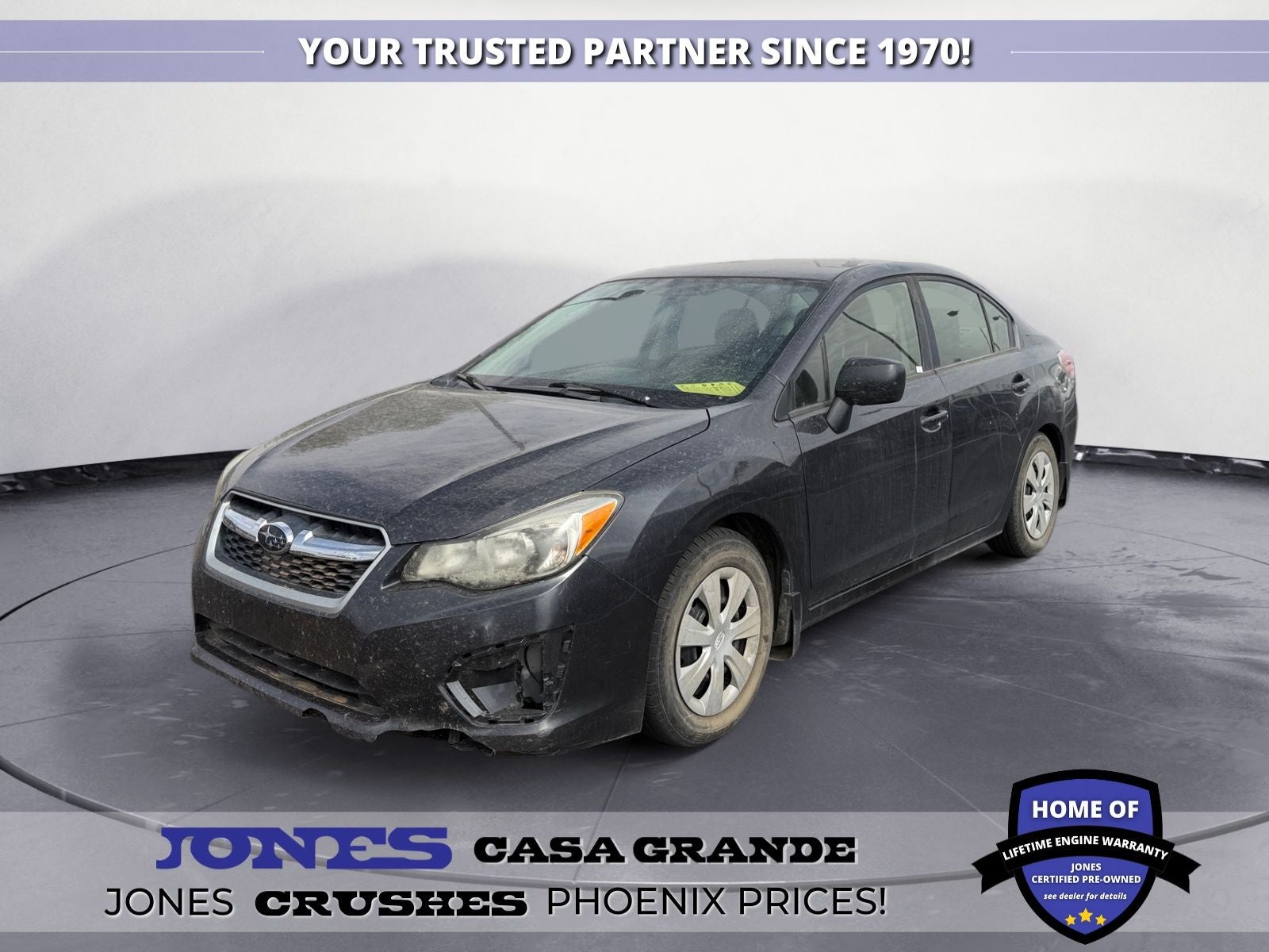 2014 Subaru Impreza 2.0i in Dark Gray Metallic — front three-quarter view